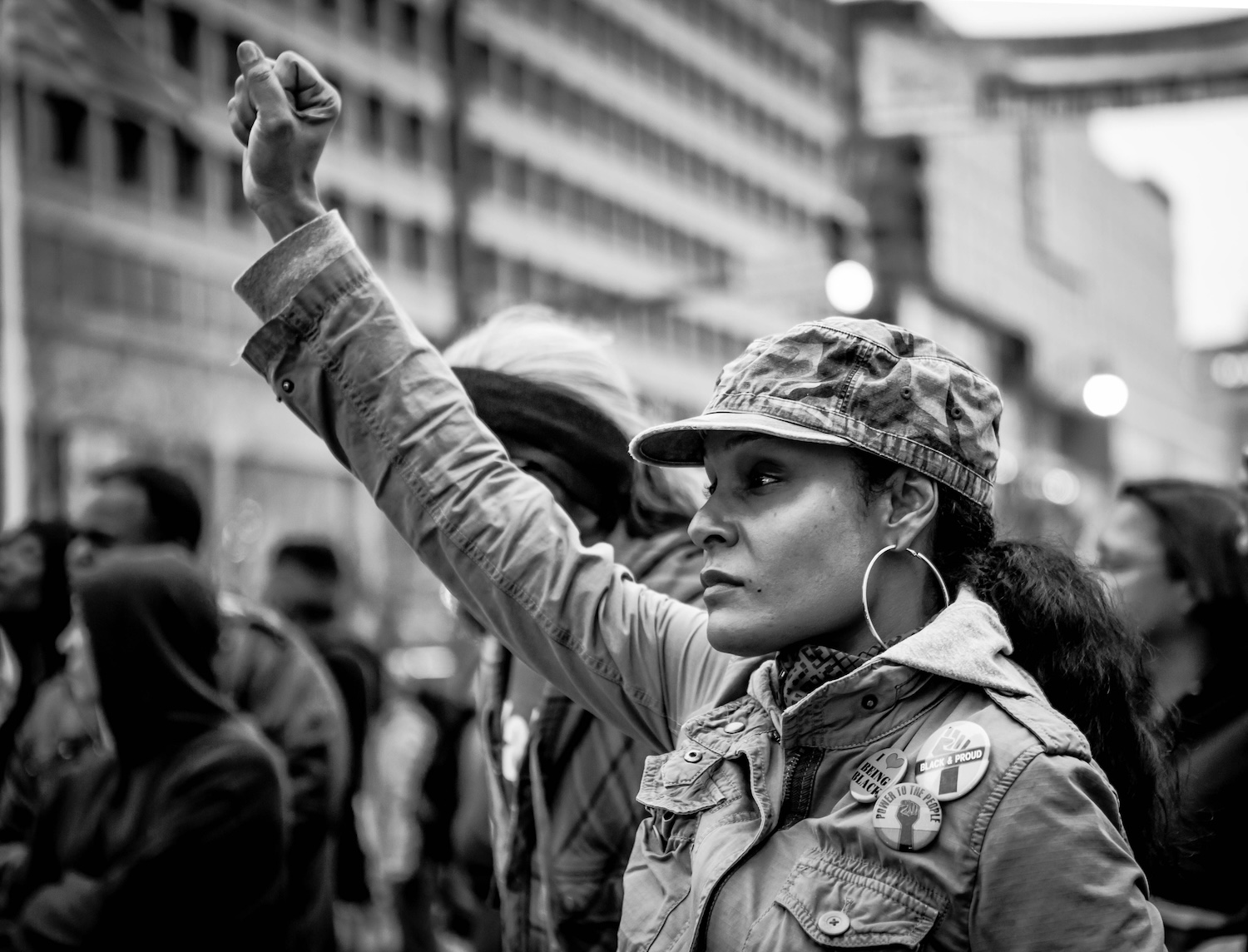 Black and white photo of a Woman holding up her fist